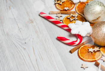 Christmas frame made from oranges. cinnamon, candies, various festive decor. copy space, free space for your text. close up