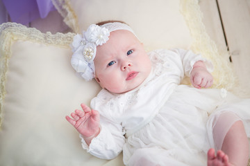 Little baby girl in a beautiful dress