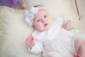 Little baby girl in a beautiful dress
