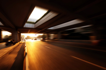 busy road under modern bridge