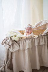 Fototapeta na wymiar Little baby girl in a beautiful dress