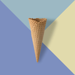 Ice cream cone on pastel colorful background. Minimal summer concept.