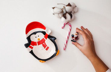 Girl packs Christmas gifts. Top view.