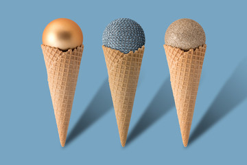 Ice cream cones with christmas balls on bright blue background. Minimal style.  Holiday concept.