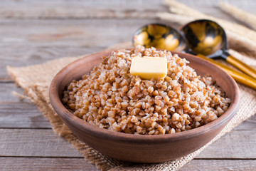 Buckwheat in a bowl. Healthy food. Buckwheat porridge and butter
