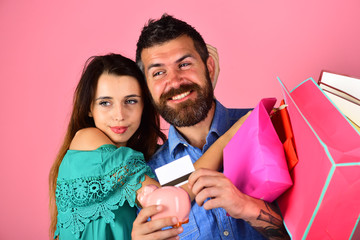 Shopping and spending concept. Man with beard holds credit card
