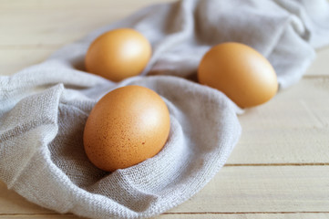Eggs on wooden background.