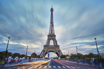 Eiffel tower view during the twilight, long exposure image with cloud and light trails