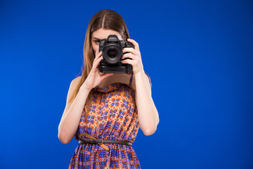 Girl with a camera in hand