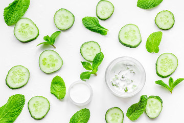 Cucumber moisturising cream or mask pattern. White background top view