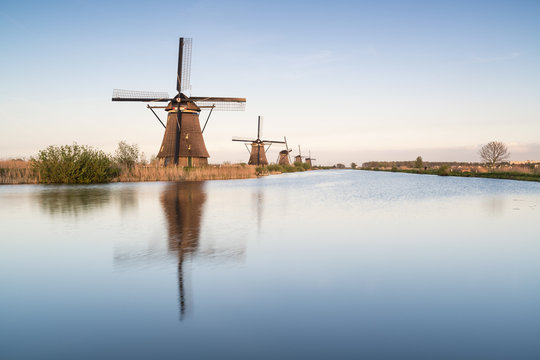 Windmills in a row on the canal, Kinderdijk, Molenwaard municipality, South Holland province, Netherlands