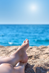 Woman relaxing on the beach.