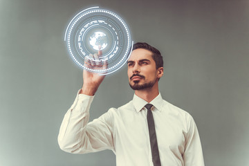 Handsome businessman with touchscreen