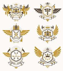 Obraz premium Vintage heraldry design templates, vector emblems created with bird wings, crowns, stars, armory and animal illustrations. Collection of vintage style symbols.