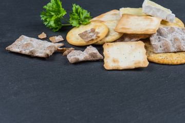 Dry cracker cookies with black background