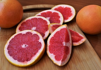 Grapefruit sliced on the cutting board.