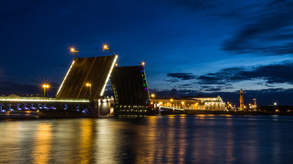 Fototapeta na wymiar Palace Bridge (1912-1916), a road- and foot-traffic bascule bridge, spans the Neva River between Palace Square and Vasilievsky Island. White nights in Saint Petersburg, Russia