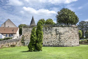 France, Burgundy, Beaune: City wall with green trees and blue sky. The town is one of the key...