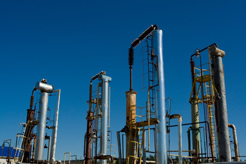 Factory chimneys on the sky background