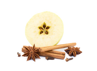 Aromatic apple, star anise, cloves and cinnamon isolated on white background