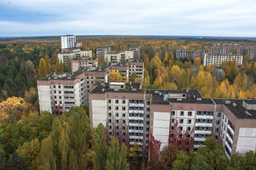 Fototapeta na wymiar Vew from roof of 16-storied apartment house in Pripyat town, Chernobyl Nuclear Power Plant Zone of Alienation, Ukraine at autumn time