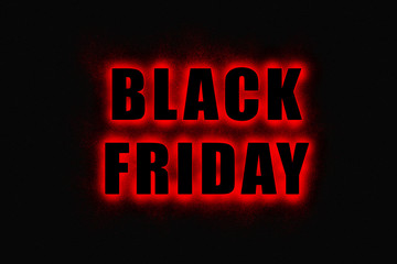 Black Friday sign, large black letters with bright red glowing outline on black background 