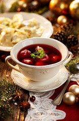 Christmas beetroot soup, borsch with small dumplings with mushrooms stuffing, traditional Christmas eve dish in Poland