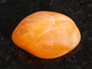 polished yellow aventurine gemstone on dark