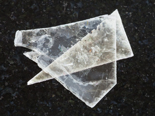 raw muscovite mica lamina on dark background