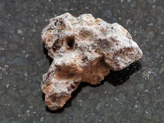 rough Basalt stone on dark background