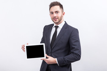 Picture of attractive businessman with tablet computer