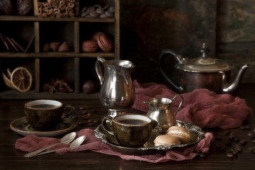 Coffee, chocolate and sweets. Still life in vintage style.