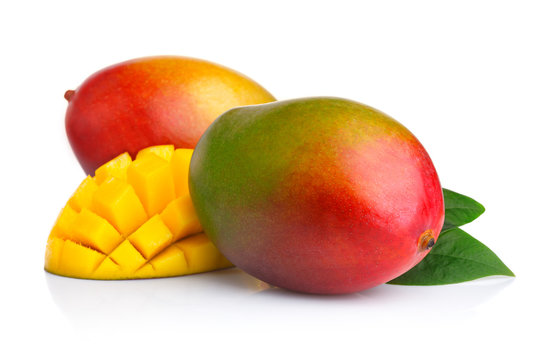 Ripe mango fruits with slices isolated on white