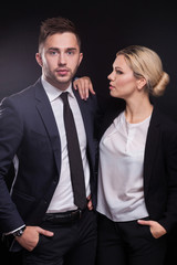 Picture of young couple of office workers standing