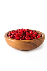 Berries of a cranberry in a wooden bowl on a white background isolate close-up