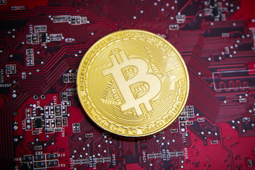 bitcoin coin and printed circuit board
