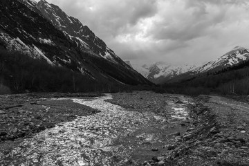 Black and White view of mountain river. Concept of calendar about Caucasus Mountains and Karachai-Cherkess Republic in Russia. Black-and-white greyscale photo with high contrast.