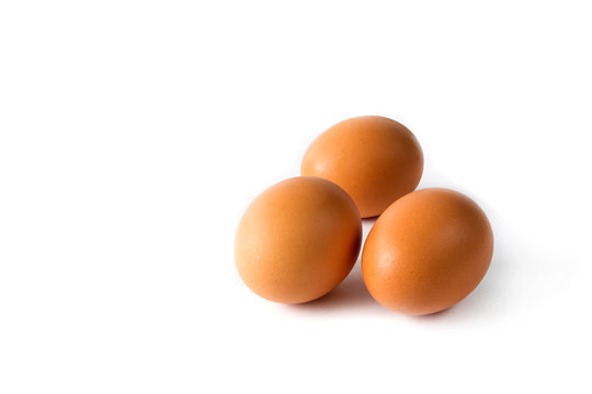 Chicken eggs brown close-up on white background isolate