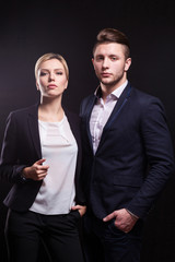 Picture of attractive couple of office workers standing