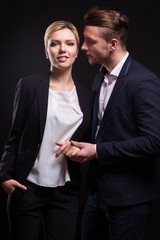 Picture of attractive couple of office workers standing