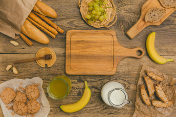 Healthy snacks on wooden table with copy space.