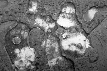 Black and white bubble background. Psychedelic background made of the paint, soap and oil