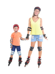 Mother and son on roller skates against white background