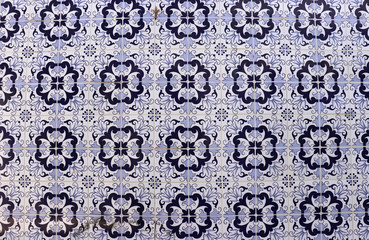 Ornamental blue tiles on a facade in Portugal