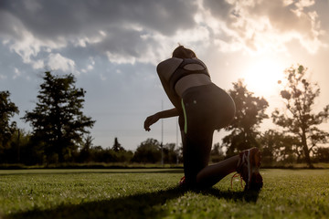 Young women is preparing to run, training concept