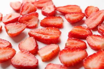 Fresh strawberry slices on white background
