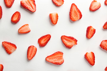 Fresh strawberry slices on white background