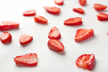 Fresh strawberry slices on white background