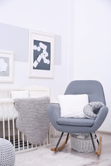 Baby bedroom design with white crib and rocking chair