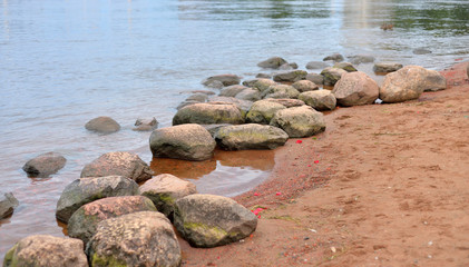 Fototapeta na wymiar Granite stones on the river bank.